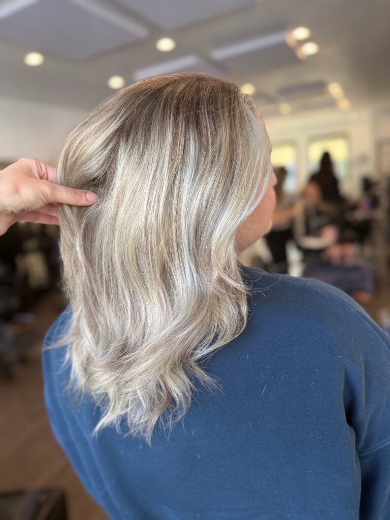 Bright blonde balayage with curled ends