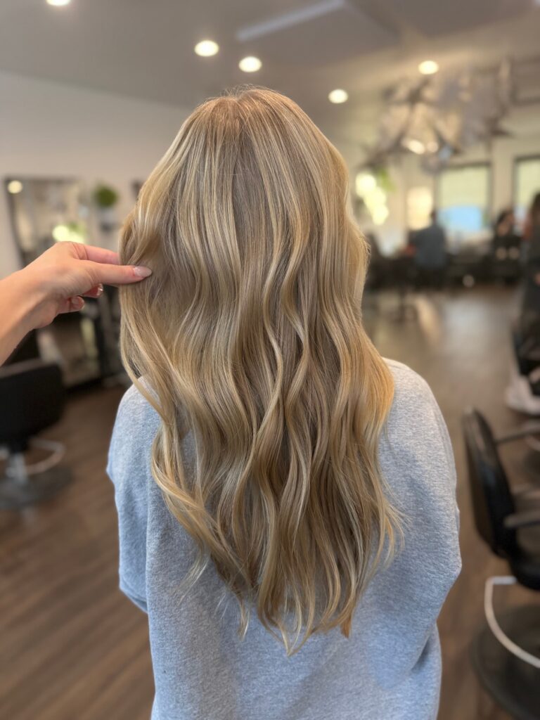 Long dimensional blonde hair with loose curls